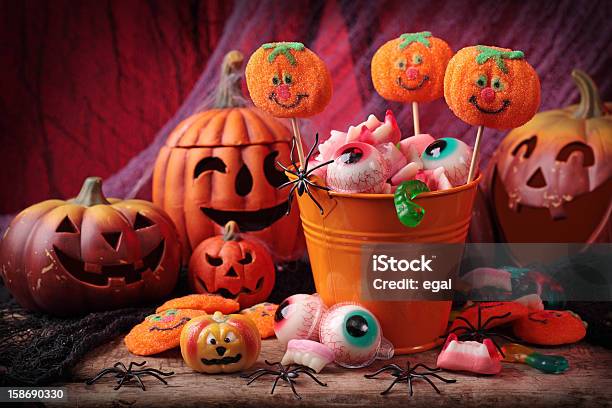 Festive Picture Of Carved Pumpkins And Halloween Sweets Stock Photo - Download Image Now