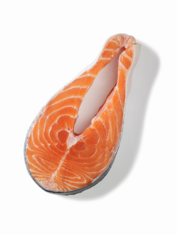Slice of raw salmon (isolated with clipping path over white background)