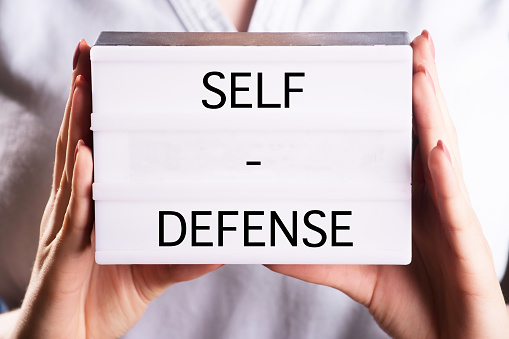 woman and self defense sign, preparation against acts of violence