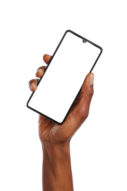 istock Black woman keeps hand raised while holding smart phone isolated 1586919133