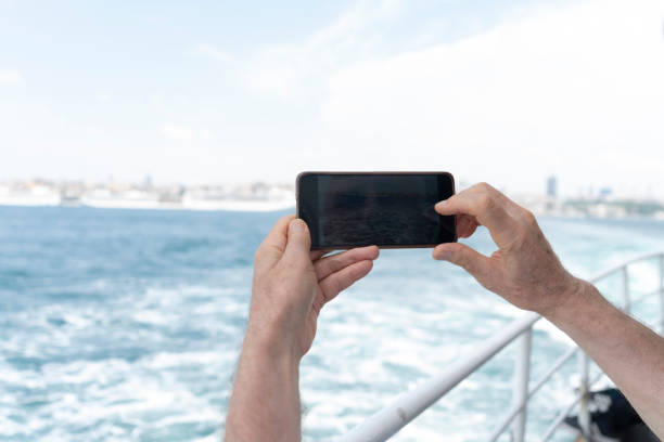 istock Senior man traveling on a ferry boat 1586919539