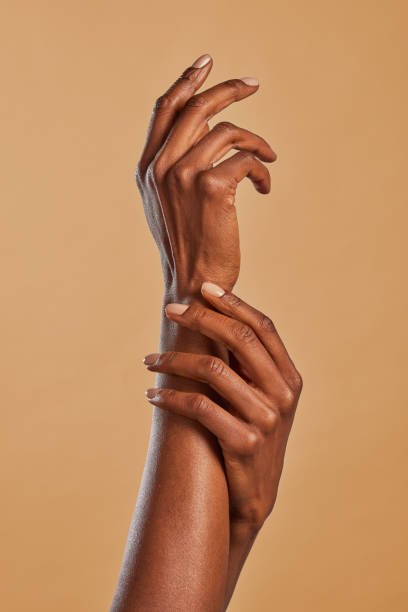 istock Beautiful black female hands pamper each other 1586921180