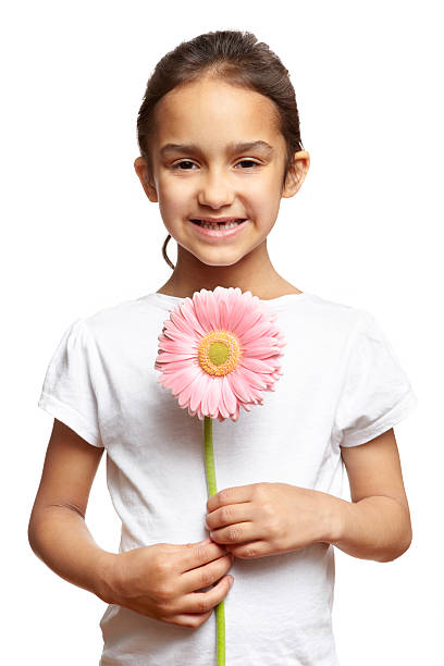 istock Girl smiling with pink flower 158692208