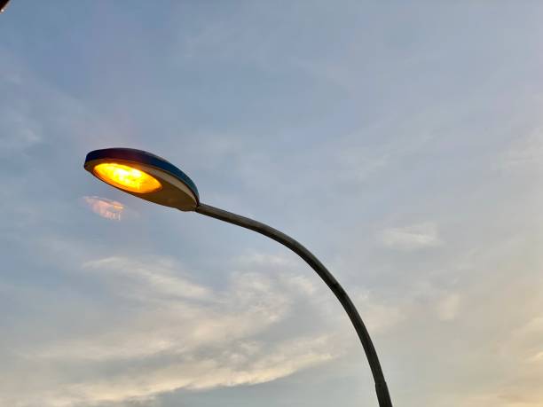 istock Street lights turn on at dusk 1586924932