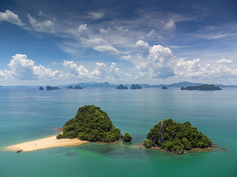 Aerial view of tropical Island beautiful green lagoon and white sandy beach surrounded by limestone at Hong Island, Krabi, Thailand