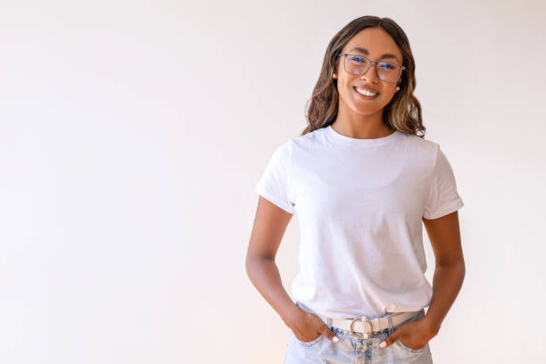istock Young laughing woman standing 1586946441
