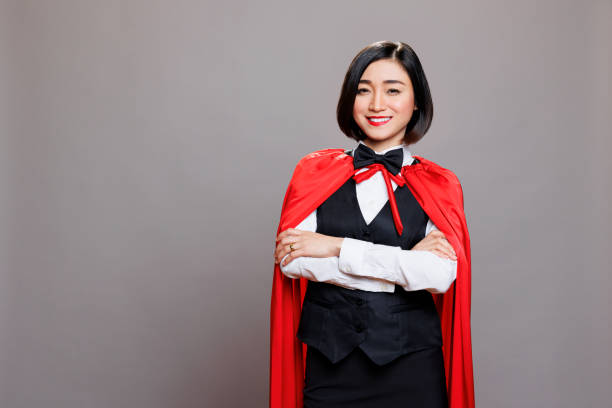 istock Waitress in red superwoman cloak 1586951196