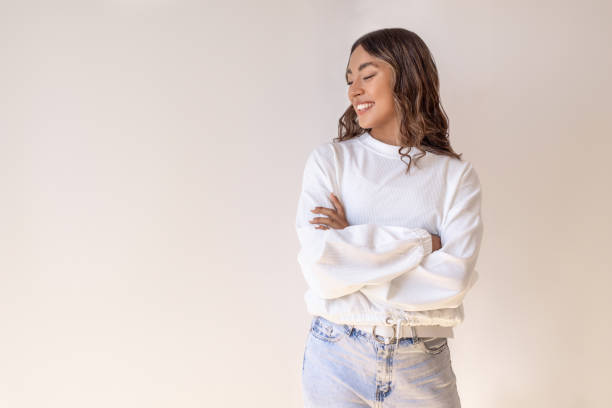 istock Young laughing woman standing 1586953928