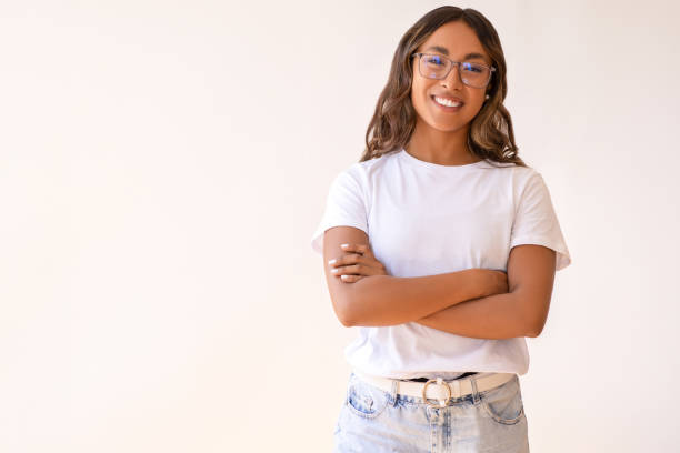 istock Young laughing woman standing 1586954481