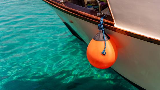 Orange float on the side of a boat