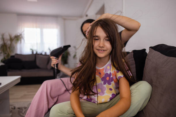 istock Mommy, I need help drying my hair 1586976812