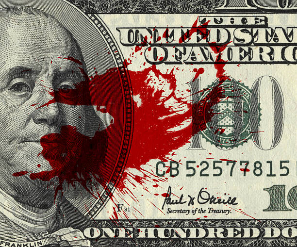 Blood Money Fragment of 100 dollar bill with blood spots bloody money stock pictures, royalty-free photos & images