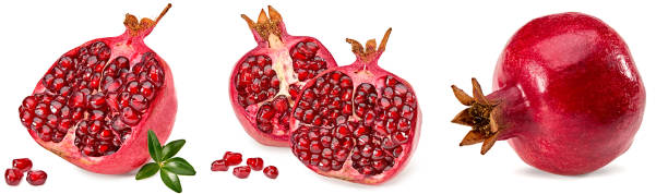istock pomegranate with seeds and green leaves isolated on a white background. clipping path 1586998036