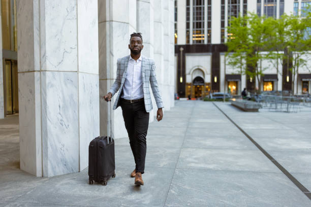 istock Affluent black businessman on a trip to NYC 1587002827