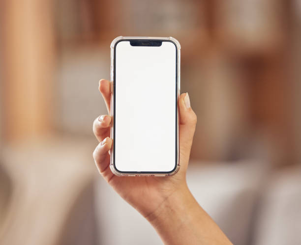 istock Hand, phone and blank or mockup screen for advertising website, internet connection or network. Person with a smartphone and space for ux, mobile app ui or digital marketing and branding promotion 1587008562