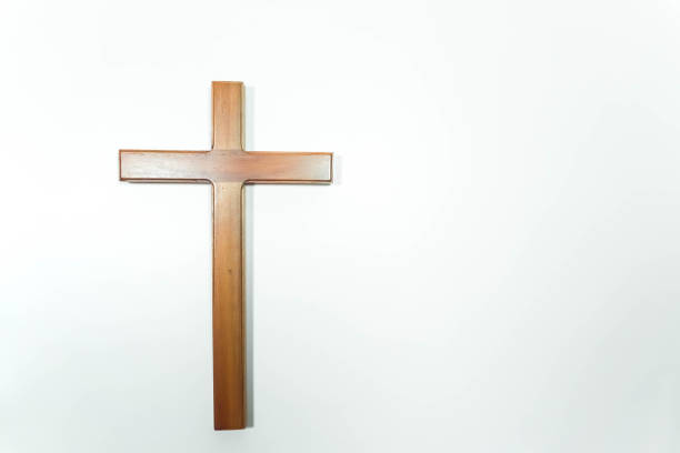 istock A Jesus wooden cross isolated on white background 1587027399