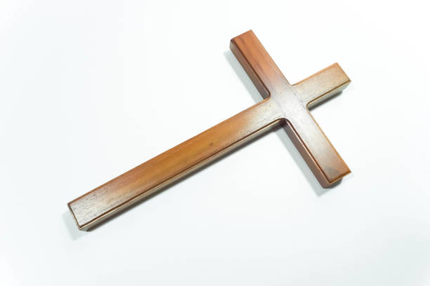 istock A Jesus wooden cross isolated on white background 1587027466