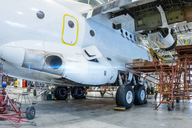 istock White transport airplane in the hangar 1587029549