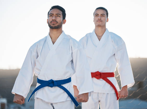 istock Men, karate team and outdoor training with mindset, thinking and start workout in morning for development. Martial arts partnership, together and sunshine with focus for exercise, coaching or sports 1587030124