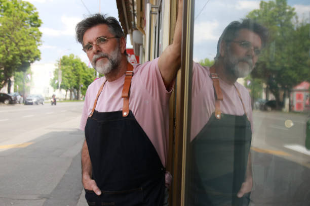 istock A senior man in front of his shop 1587058340
