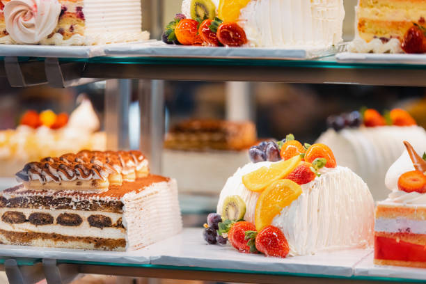 istock cake with strawberries, yummy assortment baked pastry in bakery. Various Different Types Of Sweet Cakes In Pastry Shop Glass Display. Good Assortment Of Confectionery. buffet with many desserts 1587062817