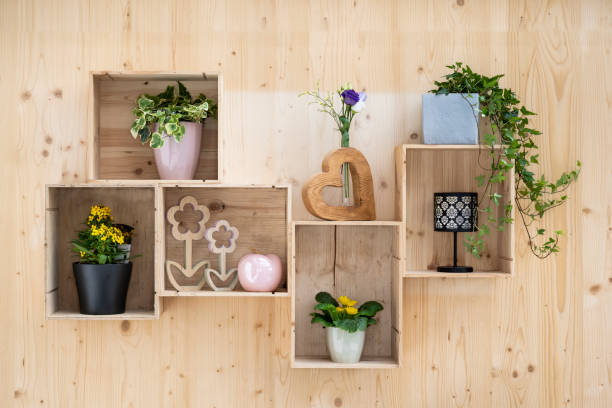 istock self-made wall decoration with old wine crates as a flower shelf on spruce board 1587065044