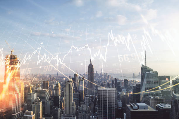 Multi exposure of virtual creative financial chart hologram on New York skyscrapers background, research and analytics concept
