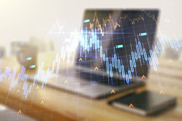 istock Double exposure of abstract creative financial chart with world map and modern desktop with laptop on background, research and strategy concept 1587085546