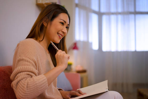 istock Pretty woman has leisure activity at home. 1587101178