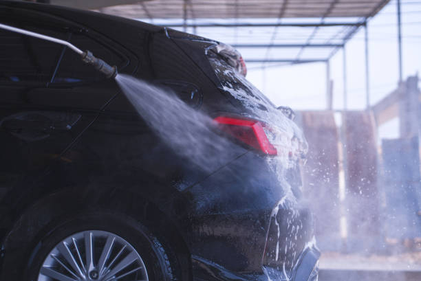 istock Car washing cleaning car using high pressure water background 1587117487