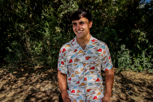 young man wearing a shirt at the park