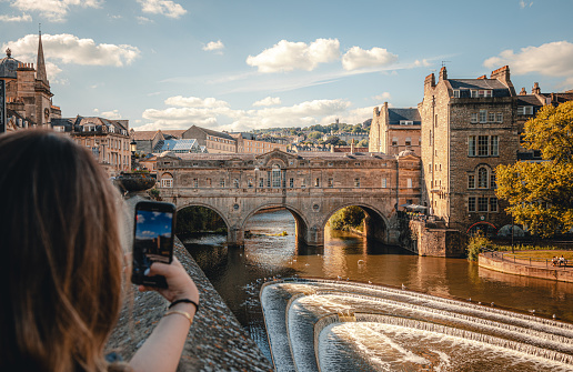 Landscape view of Bath Pulteney Bridge over River Avon in Bath, Somerset, England United Kingdom in spring time. Bath and North East Somerset unitary area in the county of Somerset England, known for and named after its Roman-built baths.