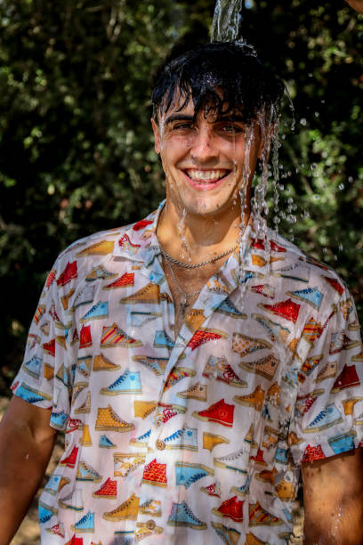istock Young man wet at the park 1587144216