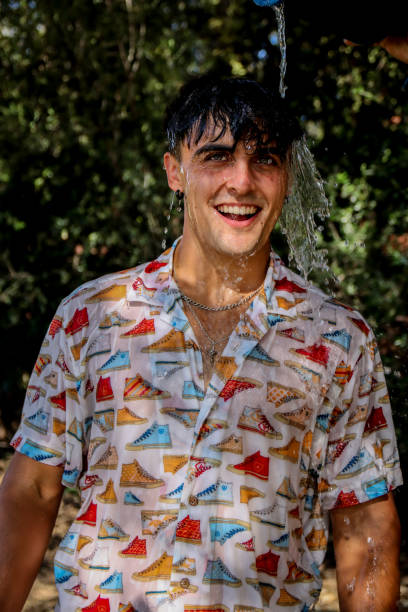 istock Young man wet at the park 1587144731