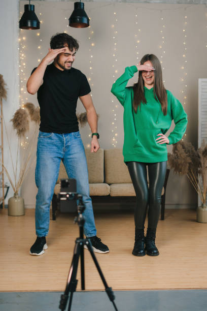 istock Happy couple with photo camera 1587146320