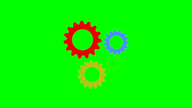 Gears of different colors spinning on a green chroma key background