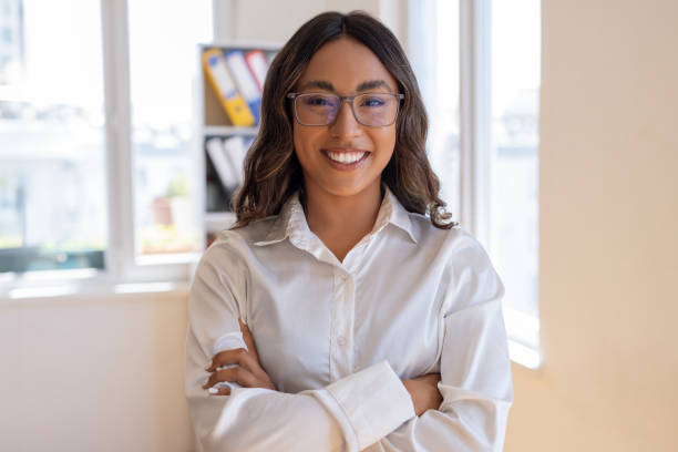 istock Woman in the office with positive 1587154338