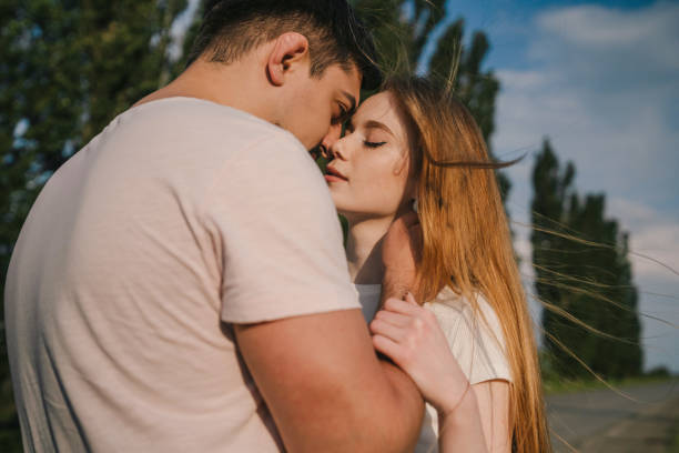 istock Loving couple hugging in nature 1587154893