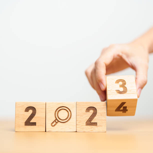 istock 2024 block with magnifying glass icon. SEO, Search Engine Optimization, hiring , Advertising, Idea, Strategy, marketing, Keyword, Content and New Year start concepts 1587179561
