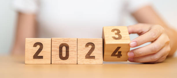 istock 2023 change to 2024 year block on table. goal, Resolution, strategy, plan, start, budget, mission, action, motivation and New Year concepts 1587180187