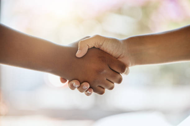 istock Handshake, partnership and hands with support or welcome, trust and agreement with team building or thank you. People shaking hands, team and partner with solidarity and onboarding with commitment. 1587191560