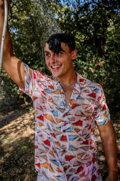 Young man wet at the park