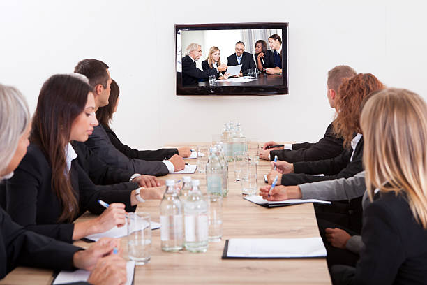 istock Businesspeople Sitting At Conference Table 158720486