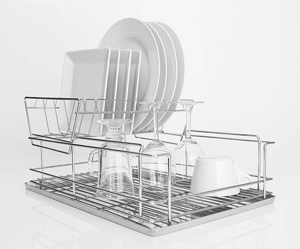 istock White dishes drying on metal dish rack 158720493