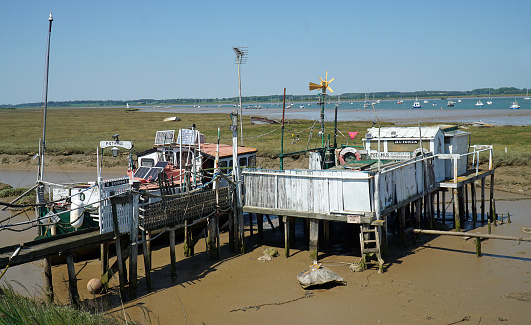 Felixstowe, Suffolk, England -  June 14  2023: Houseboat Dwelling in the mud flats near the estuary of the river Deben Suffolk.
