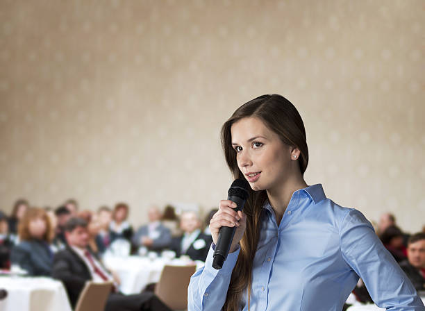 istock Businesswoman speaking at conference 158721920