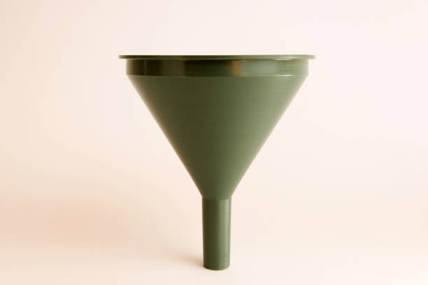 istock Green plastic watering can on a white background. 1587231845
