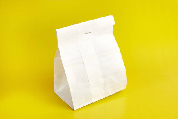 istock Paper bag with coffee beans, sewn with thread. Dry food packaging. 1587235142