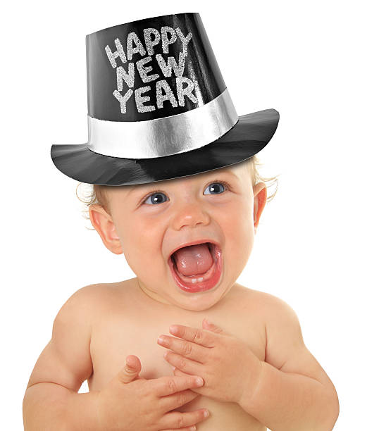 Happy baby with new years eve hat on stock photo