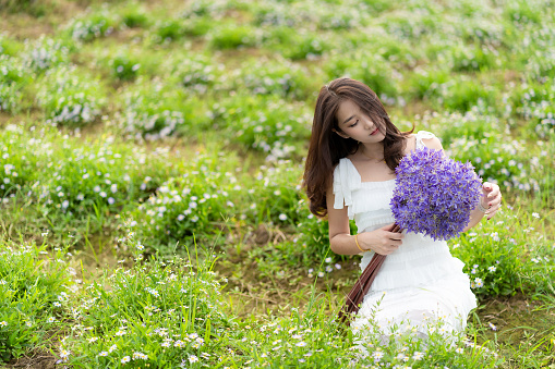 Portraits of a beautiful 4-year-old Argentine girl in a flower field- Buenos Aires - Argentina